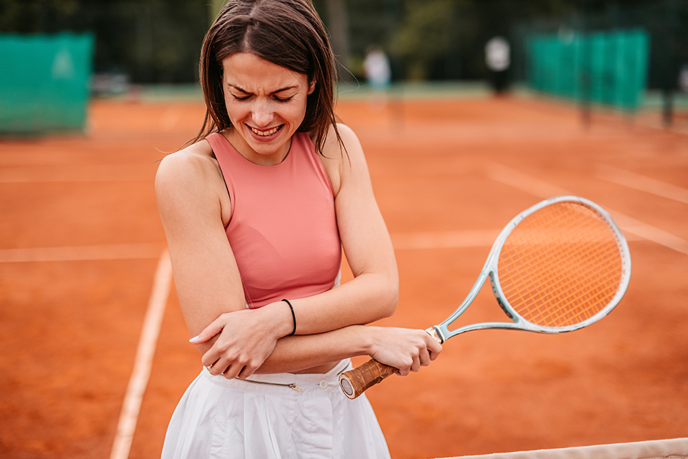 woman suffering from tennis elbow